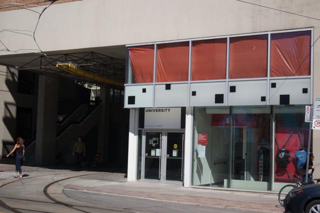 Photo of the “OCAD University” sign at 51 McCaul as seen from across the street